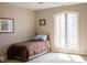 Comfortable bedroom with a large window, neutral decor, and ample light at 23219 Marin Dr, Cicero, IN 46034