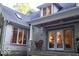 Beautiful brick home featuring a covered porch with seating and wind chimes at 23219 Marin Dr, Cicero, IN 46034
