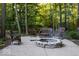 Cozy outdoor fire pit surrounded by wicker furniture and lush greenery at 23219 Marin Dr, Cicero, IN 46034