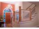 Grand foyer with hardwood floors, chandelier, and staircase at 23219 Marin Dr, Cicero, IN 46034