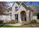 Lovely home featuring a stone archway entrance, a red door, and decorative potted plants at 23219 Marin Dr, Cicero, IN 46034