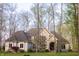 Beautiful home with stone and brick facade, landscaped front yard, and mature trees offering shade and privacy at 23219 Marin Dr, Cicero, IN 46034