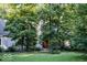 Lovely home surrounded by trees, showcasing its well-maintained lawn and inviting facade at dusk at 23219 Marin Dr, Cicero, IN 46034