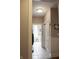 Hallway features tiled flooring, white trim and an entry to the laundry room at 23219 Marin Dr, Cicero, IN 46034