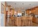 Well-appointed kitchen with wood cabinets, counter seating, and open layout for easy entertaining at 23219 Marin Dr, Cicero, IN 46034