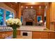 Spacious kitchen with wood cabinets and counters, offering a seamless flow to the living area at 23219 Marin Dr, Cicero, IN 46034