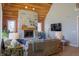 Inviting living room boasting stone fireplace, wood ceiling, and comfortable seating for relaxing at 23219 Marin Dr, Cicero, IN 46034