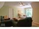 Comfortable living room with plush seating and natural light from a large window at 23219 Marin Dr, Cicero, IN 46034