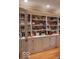 The living room has a large built-in bookshelf with storage and hardwood floors at 23219 Marin Dr, Cicero, IN 46034