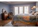 Bright main bedroom features a comfortable bed, dresser and access to a back patio at 23219 Marin Dr, Cicero, IN 46034