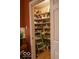 Walk-in pantry providing ample storage space with multiple shelves for organized kitchen supplies at 23219 Marin Dr, Cicero, IN 46034