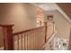 Staircase with white railing and wooden banister at 23219 Marin Dr, Cicero, IN 46034