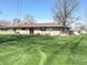 Expansive backyard with a spacious deck, perfect for outdoor entertaining and relaxation at 243 E Benton St, Alexandria, IN 46001