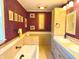 A full bathroom features a tub, and a double sink vanity with tile counters at 243 E Benton St, Alexandria, IN 46001