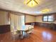 Spacious dining room with wainscoting and a sliding glass door for natural light at 243 E Benton St, Alexandria, IN 46001