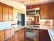 Functional kitchen featuring stainless steel appliances and an open view into the dining area at 243 E Benton St, Alexandria, IN 46001
