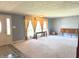 Inviting living room featuring neutral carpet, stylish furnishings, and ample natural light at 243 E Benton St, Alexandria, IN 46001