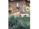 Charming backyard decor including stone bench, flower pots and garden-themed wall art on the fence at 251 E South St, Franklin, IN 46131
