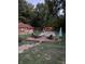 Beautiful backyard featuring an in-ground pool, deck with lounge chairs, and charming gazebo at 251 E South St, Franklin, IN 46131