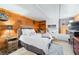 Rustic basement bedroom with wood paneling, cozy decor, and a comfortable bed setup at 251 E South St, Franklin, IN 46131