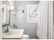 Well-lit bathroom featuring a clean white vanity, framed mirror, and fresh, neutral decor at 251 E South St, Franklin, IN 46131