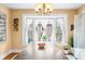 Dining room with a large window, wood table, and modern chandelier at 251 E South St, Franklin, IN 46131