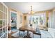 Dining room featuring a wood table, bay window, and an access to the kitchen at 251 E South St, Franklin, IN 46131