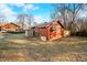 A charming home featuring a green and white striped awning and a well-maintained lawn at 251 E South St, Franklin, IN 46131