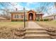 Charming vintage brick home with a landscaped front yard and traditional design elements at 251 E South St, Franklin, IN 46131