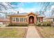 Charming brick home featuring a classic arched entryway and well-manicured front yard at 251 E South St, Franklin, IN 46131