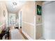 Bright hallway with hardwood floors and neutral walls leading to a cozy living area at 251 E South St, Franklin, IN 46131