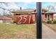 Prominent house number 251 displayed on a wooden plaque, set against a backdrop of the home at 251 E South St, Franklin, IN 46131