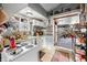 Kitchen featuring white cabinets, open pantry shelving, and access to other rooms at 251 E South St, Franklin, IN 46131