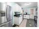 Bright kitchen with stainless steel appliances, white cabinets, and modern finishes at 251 E South St, Franklin, IN 46131