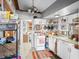 Country kitchen featuring white cabinetry, tiled floors, and lots of open shelving at 251 E South St, Franklin, IN 46131