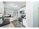 Charming kitchen featuring white cabinets, stainless steel appliances, and tile floors at 251 E South St, Franklin, IN 46131