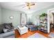 Well-lit living room featuring hardwood floors, comfortable seating, and stylish decor at 251 E South St, Franklin, IN 46131