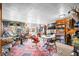 Eclectic living room features a vintage rug, unique decor, and lots of natural light at 251 E South St, Franklin, IN 46131