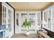 Relaxing sunroom with large windows, a potted plant, and plenty of natural light at 251 E South St, Franklin, IN 46131