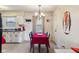 Inviting dining area featuring a dining table with seating and a chandelier at 3024 N Huber St, Indianapolis, IN 46226
