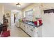 Bright kitchen with a double basin sink, ample cabinetry, and a window at 3024 N Huber St, Indianapolis, IN 46226