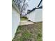 The backyard of the property with a white sided house and garage at 310 N Monroe St, Muncie, IN 47305