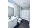 This bathroom features a modern vanity, commode, and shower/tub combo at 310 N Monroe St, Muncie, IN 47305