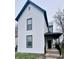 Charming two-story home featuring white siding and black trim on a cloudy day at 310 N Monroe St, Muncie, IN 47305