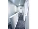 Upstairs hallway leads to the bathroom and bedrooms at 310 N Monroe St, Muncie, IN 47305