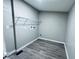 An empty laundry room features vinyl flooring and connections for a washer and dryer at 310 N Monroe St, Muncie, IN 47305