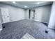 Freshly painted living room with modern gray carpet at 310 N Monroe St, Muncie, IN 47305