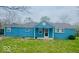 Charming exterior of a light blue home with a welcoming front porch at 3126 Newhart St, Indianapolis, IN 46217