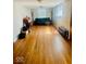 Open living room featuring wood floors and lots of natural light at 3126 Newhart St, Indianapolis, IN 46217
