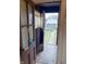 Back door with glass panels looking out to a backyard with a shed and grassy area at 330 N Beville Ave, Indianapolis, IN 46201